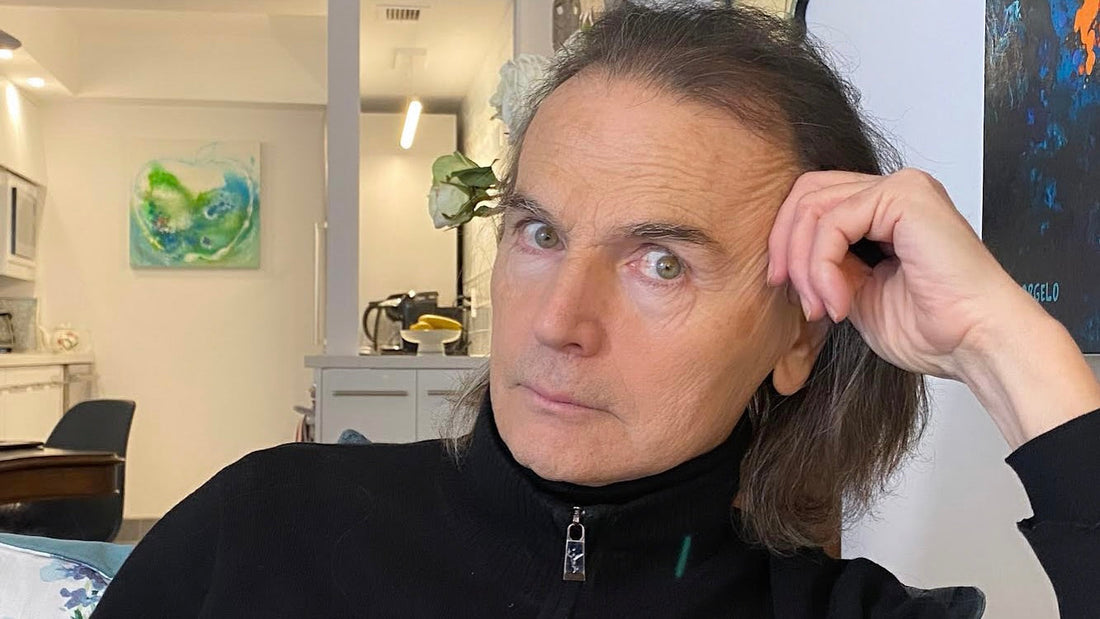 Athan Gadanidis gazing into the camera with integrity, leaning on his raised hand.