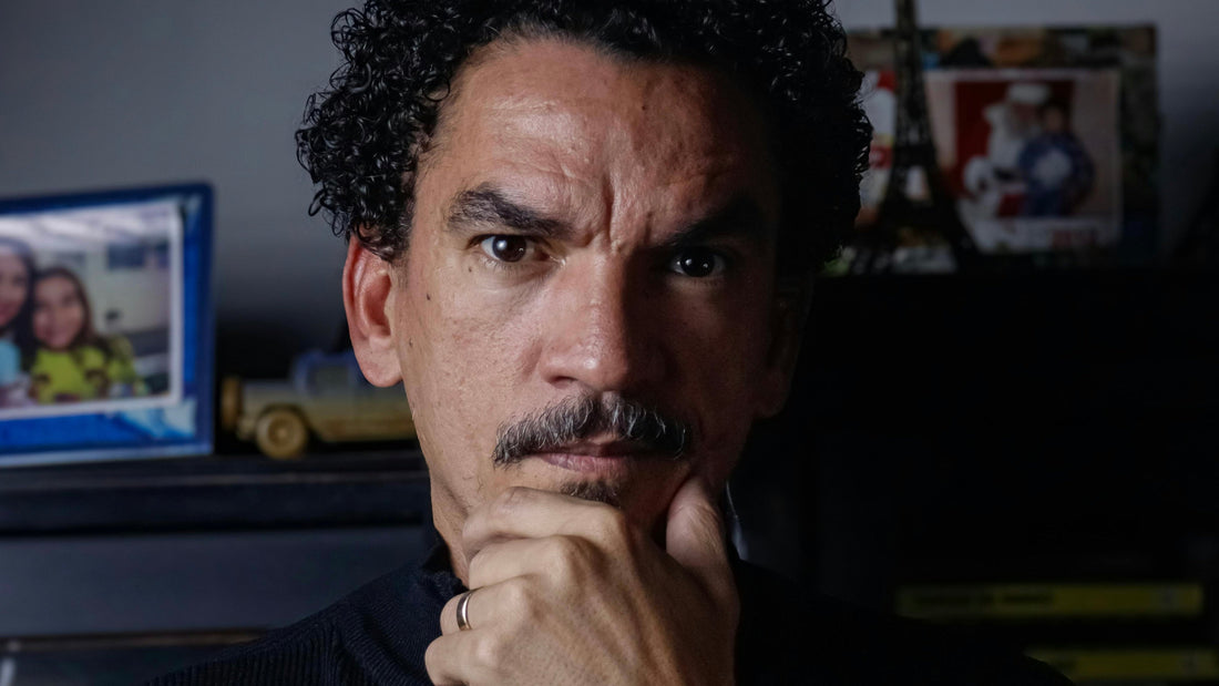 Image by Paiva on Pexels A man holding chin, looking into the camera with a discerning gaze.