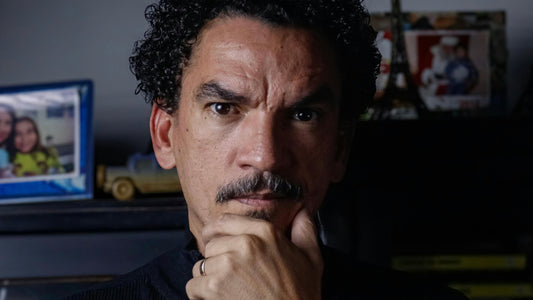 Image by Paiva on Pexels A man holding chin, looking into the camera with a discerning gaze.